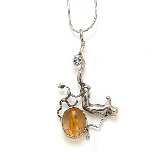 Sterling silver pendant with blue aquamarine and gold rutilated quartz.